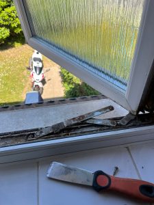 corroded window hinges hove